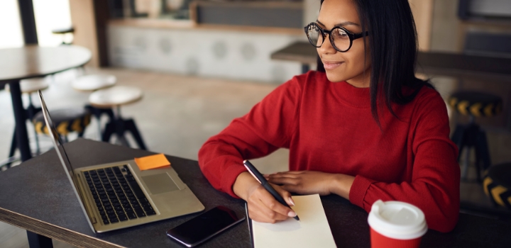 Lady working making notes